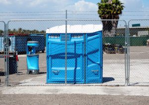 wheelchair accessible porta potty with a hand washing station